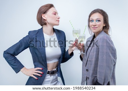 Image of two girls with glasses at a party. Holidays and entertainment concept. Mixed media