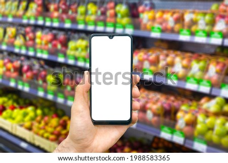 Online grocery delivery app in a mobile phone. Food market service in smartphone. Grocery delivery background concept. Empty blank screen 