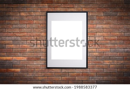 Mock up poster frame in interior wall. White frame for poster or photo image on brick loft wall in home room or office interior