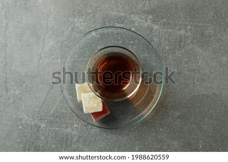 Tea and delicious turkish delight on gray background
