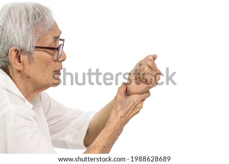 Old elderly was holding her painful wrist,inflammation of the wrist or flexor tendons,compression of carpal bones nerve,sensations of tingling,numbness in the her hands and fingers on white background