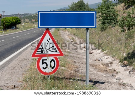 Traffic sign on the side of a road.Reduced speed limit