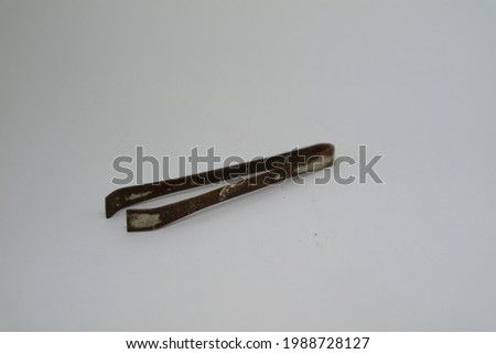 rusty old pincers usually used for health or crafts and sewing clothes