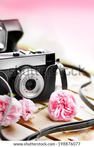 Vintage camera and roses  