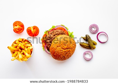 Bbq hamburgers with fries isolated on white. Top view