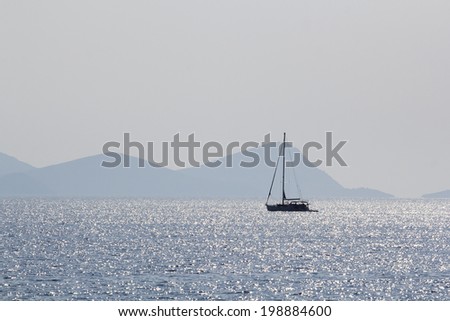 Landscape with water,boat and land in the background - Aegean sea, Greece 