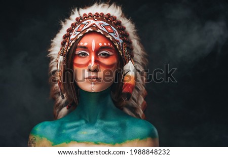 American indian woman with headdress and makeup Royalty-Free Stock Photo #1988848232