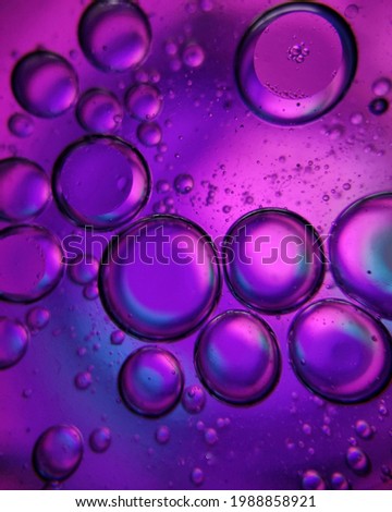 These are the mixture of water and oil. This close up shot is taken by a macro lens .Its colour combinations are very attractive.The colour of the bubble is coming from an external light source