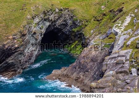 A view from Tintagel Castle, of a stunning Cave in Cornwall, UK. Royalty-Free Stock Photo #1988894201