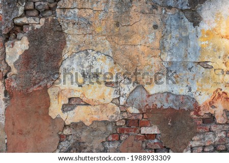 A close-up of an old broken wall