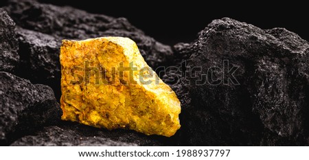 uranium ore in mine, mineral radiation concept, radioactive energy Royalty-Free Stock Photo #1988937797