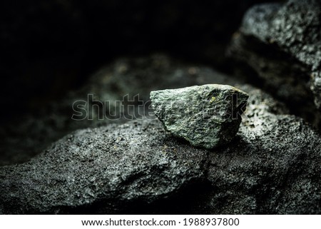 graphite ore in mine, mining concept, mineral extraction Royalty-Free Stock Photo #1988937800
