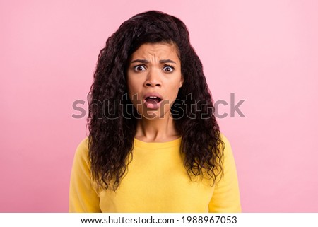 Photo of young african girl unhappy upset amazed shocked afraid scared isolated over pink color background Royalty-Free Stock Photo #1988967053