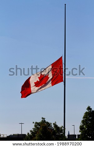 A Canadian Flag, Flying at Half Mast.