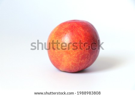 Nectarine peaches isolated on black or white background.Single fragrant ripe nectarine peaches.