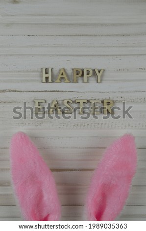 lettering "happy easter" with pink ears