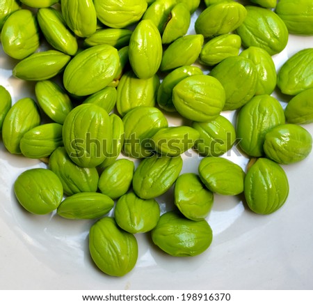 Close up of Petai (Pungent Green Bean) isolated on white background, selective focus.