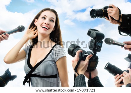 Photographers are taking a picture of a film star
