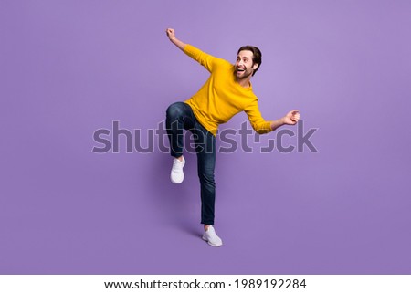 Full length body size view of attractive cheerful man dancing having fun isolated over pastel violet purple color background Royalty-Free Stock Photo #1989192284