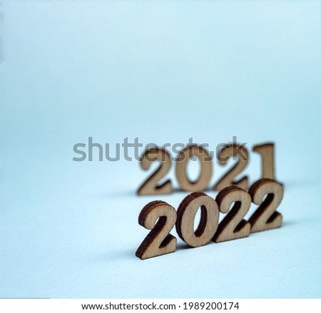 Banner 2022. Numerals 2022 on blue background. Wooden digits 2022.