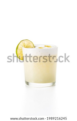 Pisco sour cocktail isolated on white background. Traditional peruvian cocktail Royalty-Free Stock Photo #1989216245