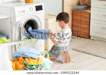 Little boy with dirty clothes at home Royalty-Free Stock Photo #1989223244