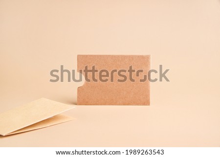 Stylish branding mockup for displaying your artwork, business cards on craft paper. Recyclable material concept, eco-friendly manufacturing. Flat top view. High quality photo