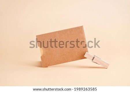 Stylish branding mockup for displaying your artwork, business cards on craft paper. Recyclable material concept, eco-friendly manufacturing. Flat top view. High quality photo