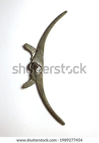 dirty old rusty iron pliers on white background