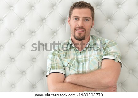 Close up porait of young man posing at home