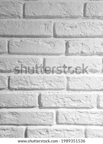 White grunge brick wall background. Photo of a white brick wall. Abstract background.