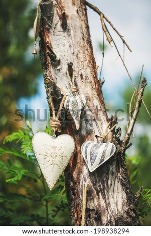 Three toys heart on tree