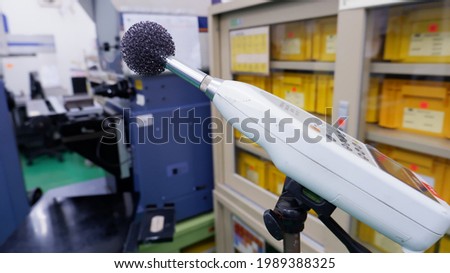noise measurement photography Loud noise in the work area in the industrial plant by the instrument to measure the noise from the environment officer all areas in the factory. Royalty-Free Stock Photo #1989388325