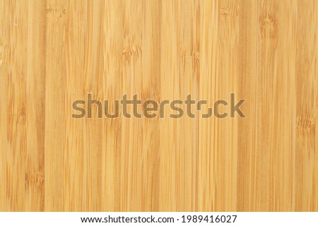 New bamboo wood cutting board surface textured background