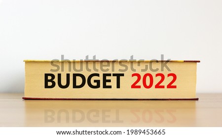 Budget planning 2022 new year symbol. Concept words 'Budget 2022' on book on wooden table. Beautiful white background. Business, budget planning 2022 new year concept.