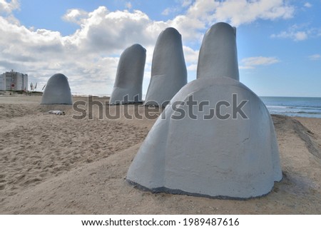Photography of The Hand in the beach La Brava, Punta del Este City, Uruguay Royalty-Free Stock Photo #1989487616