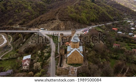 Two of Medieval Churches in Ananuri Fortress Against the Emeral Green Water of Jinvali Reservoir, Historic Place in Georgia. High quality photo