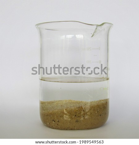 decanting water and sand separation
 Royalty-Free Stock Photo #1989549563