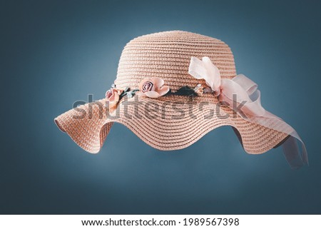 Vintage Straw hat fasion for woman isolated on white-gray background with shadow. Royalty-Free Stock Photo #1989567398