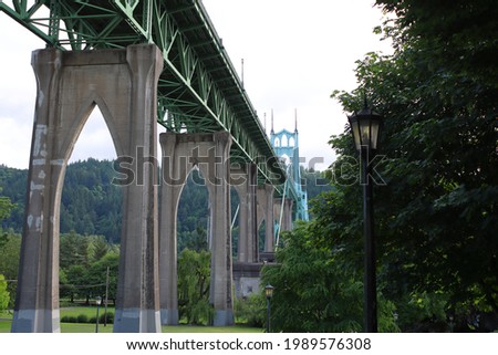 St. Johns Bridge on Willamette river, gothic shaped pillars from Cathedral park