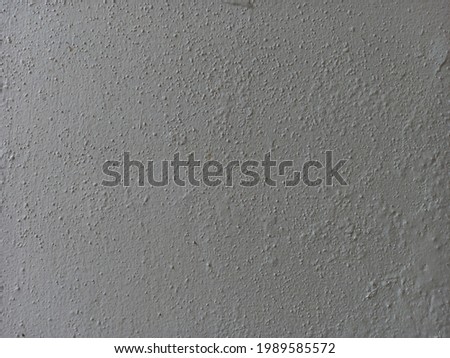 Gray cement wall is suitable for making a background.