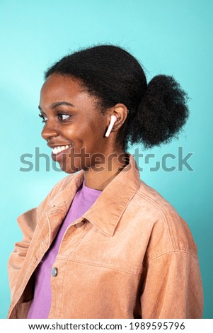 Cute woman wearing a white earphones