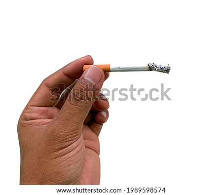A photo of a hand holding a cigarette, a dangerous and toxic substance.