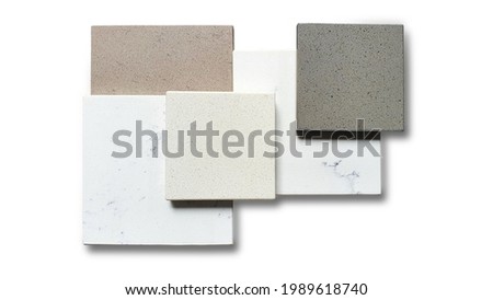 decorative artificial stone in samples with grained texture isolated on white background with clipping path. finishing material, interior renovation. artificial stone or quartz samples. Royalty-Free Stock Photo #1989618740