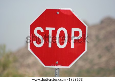 Stop sign on a desert road