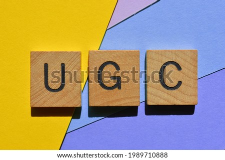 UGC, acronym for User Generated Content, in wooden alphabet letters isolated as banner headline 