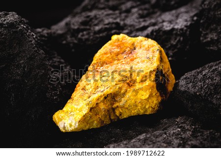 uranium ore in mine, mineral radiation concept, radioactive energy Royalty-Free Stock Photo #1989712622