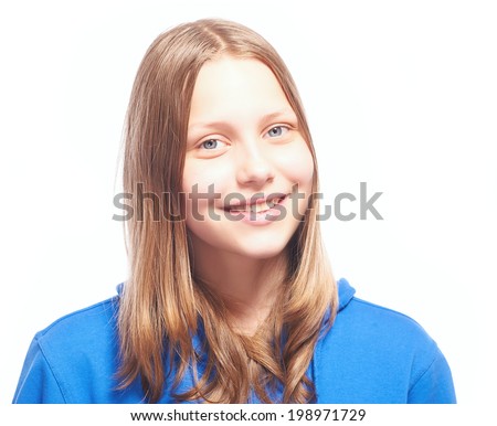 Happy teen girl laughing, studio shot