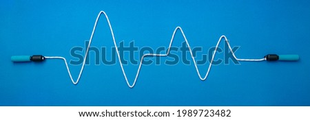 cardiogram of jump rope on blue background. Fitness and wellness, healthy lifestyle concept Royalty-Free Stock Photo #1989723482