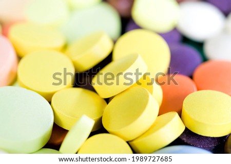yellow solid tablets closeup, tablets are a convenient means of treating various diseases